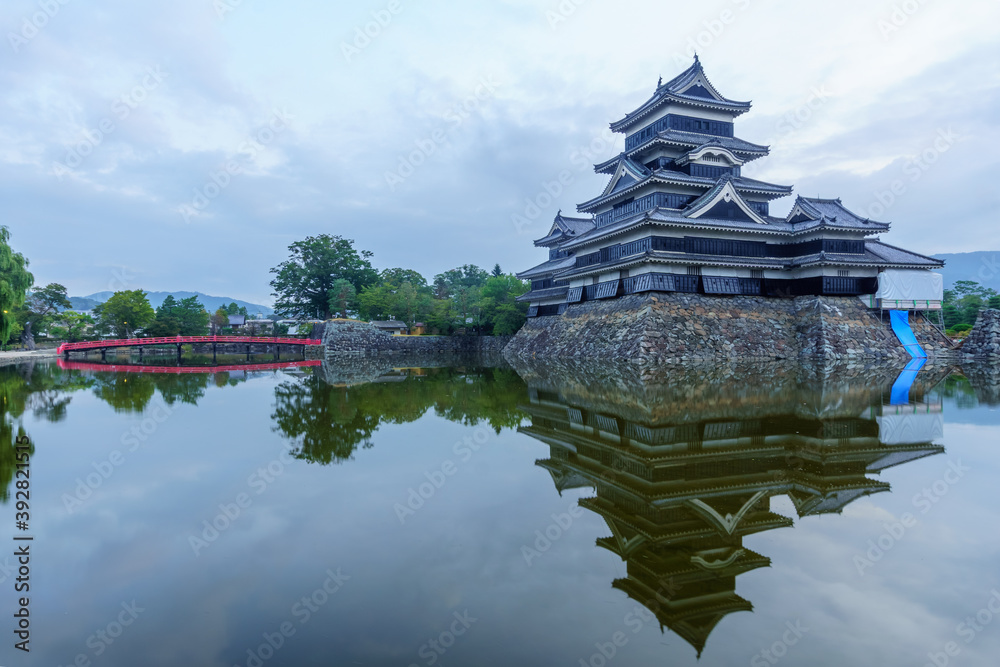 Sunrise view of Matsumoto Castle (Crow Castle) and bridge Sunrise view of Matsumoto Castle (Crow Castle) and bridge