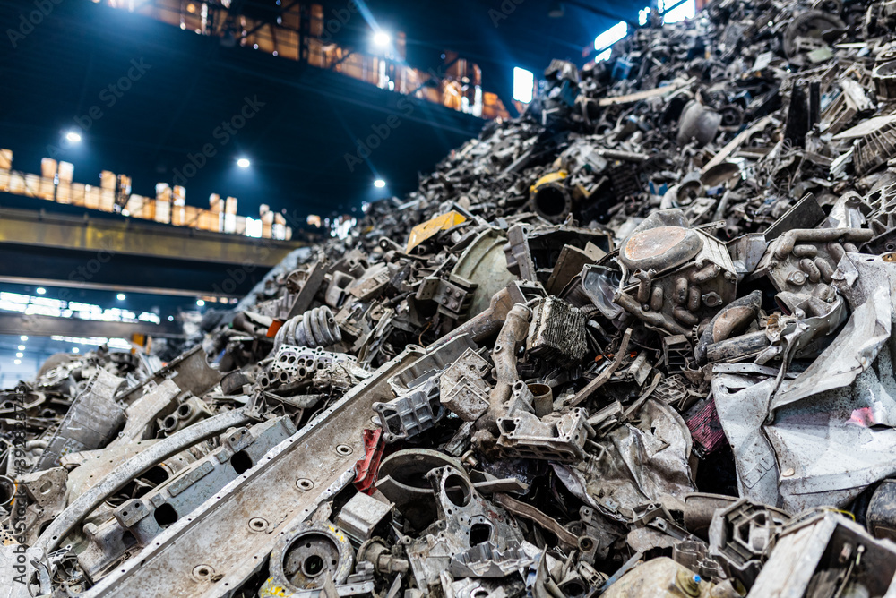Aluminium or iron scrap junk pile to be recycled melted and casted into something new