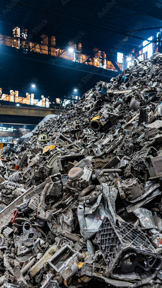 Aluminium scrap junk pile in recycling facility before being melted and casted