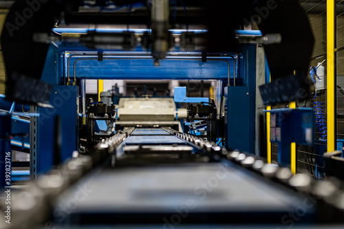 Obraz na płótnie Empty Production line in factory, with yellow safety fence, conveyor belt automated production line w salonie
