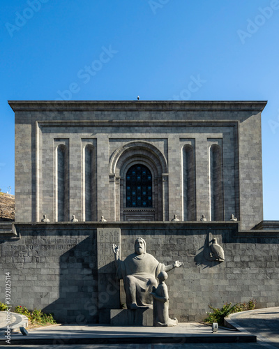Mesrop Mashtots Institute of Ancient Manuscripts, called Matenadaran and statues of Mesrop Mashtots and his disciple Koryun in the foreground,  photo