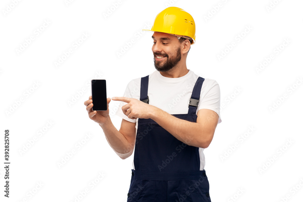 profession, construction and building - happy smiling male worker or builder in yellow helmet and overall showing smartphone over white background profession, construction and building - happy smiling male worker or builder in yellow helmet and overall showing smartphone over white background