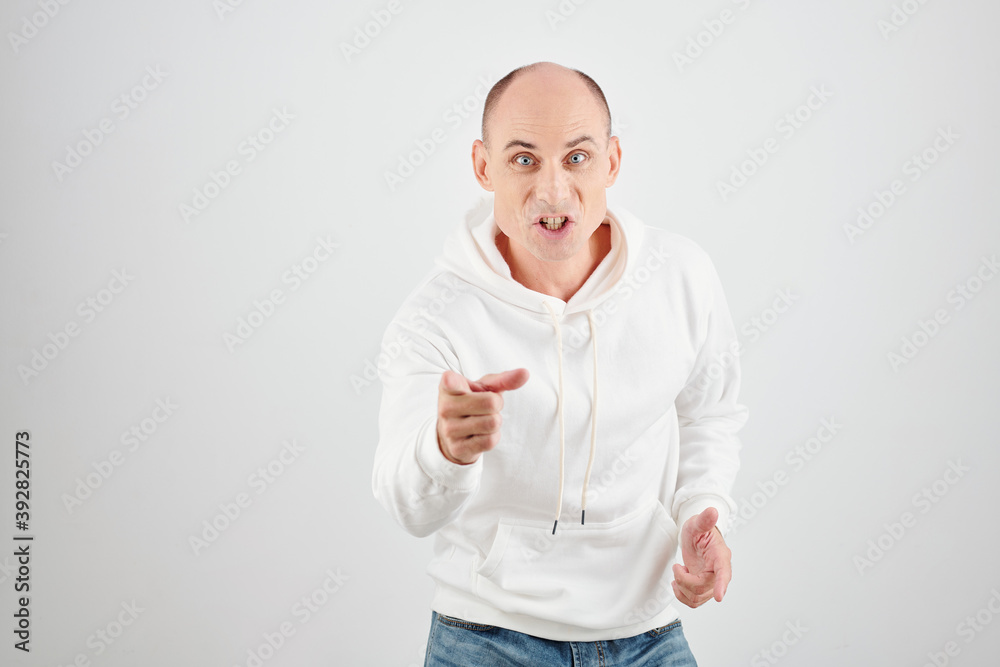 Angry man blaming opponent and pointing at camera with index finger Angry man blaming opponent and pointing at camera with index finger