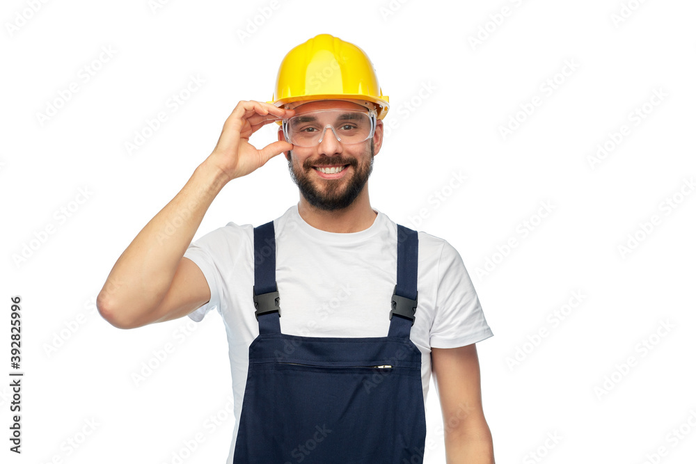 profession, construction and building - happy smiling male worker or builder in yellow helmet and overall over white background profession, construction and building - happy smiling male worker or builder in yellow helmet and overall over white background