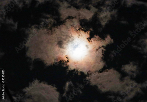 moon in the sky with clouds © Serhii Nozhenko