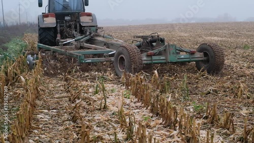 The tractor plows the ground. Slow motion.