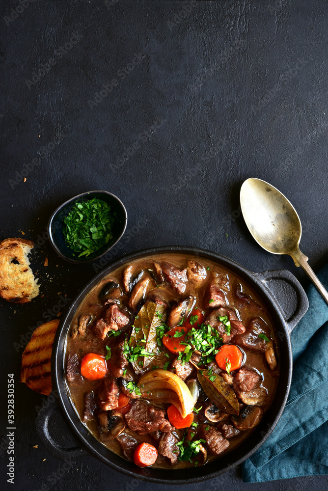 Ταπετσαρία Beef bourguignon - meat stew with vegetables and mushrooms with red wine, traditinal dish of french cuisine