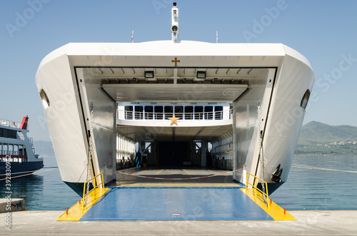 Evia island, Greece - June 30. 2020: Anchored ferry in the port of Edipsos - Greece photo
