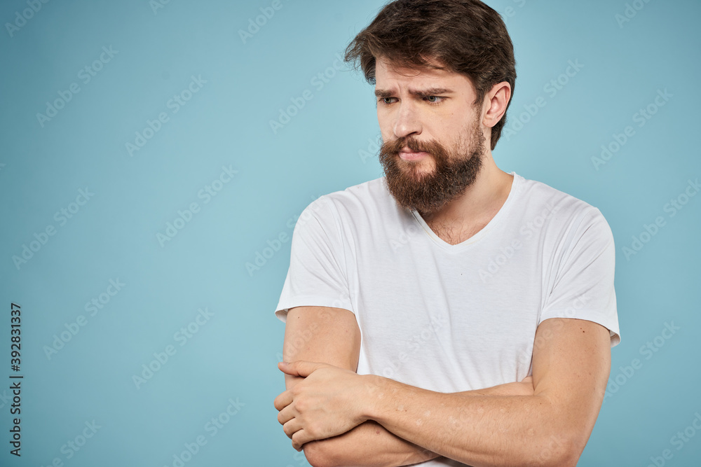 Bearded man emotions white t-shirt lifestyle gestures with hands blue backgrounds Bearded man emotions white t-shirt lifestyle gestures with hands blue backgrounds