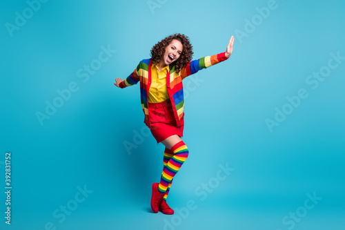 Fototapeta Naklejka Na Ścianę i Meble -  Full body photo of positive young woman happy enjoy fly plane hands isolated over blue color background