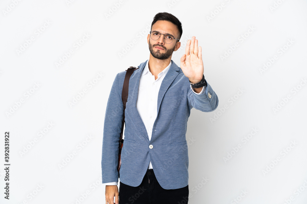 Young caucasian business man isolated on white background making stop gesture Young caucasian business man isolated on white background making stop gesture
