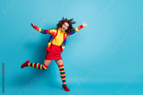 Full body photo of young pretty crazy fun girl wear skirt happy smile carefree wear casual colorful outfit isolated over blue color background
