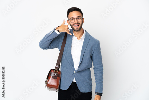 Young caucasian business man isolated on white background making phone gesture. Call me back sign