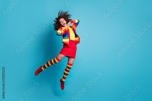 Full body photo of attractive young careless girl wear skirt jump fly happy smile rejoice isolated over blue color background