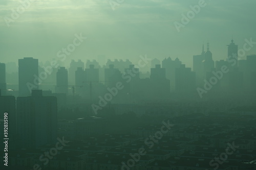 high angle view of modern city buildings in air pollution in the morning