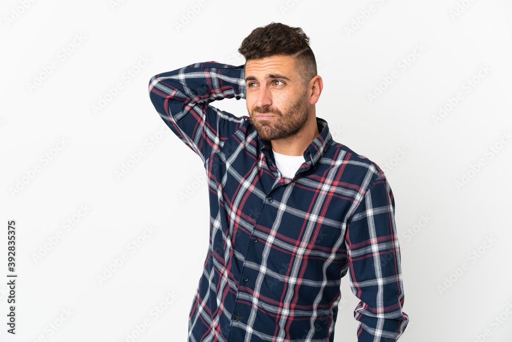 Caucasian man isolated on white background having doubts while scratching head Caucasian man isolated on white background having doubts while scratching head