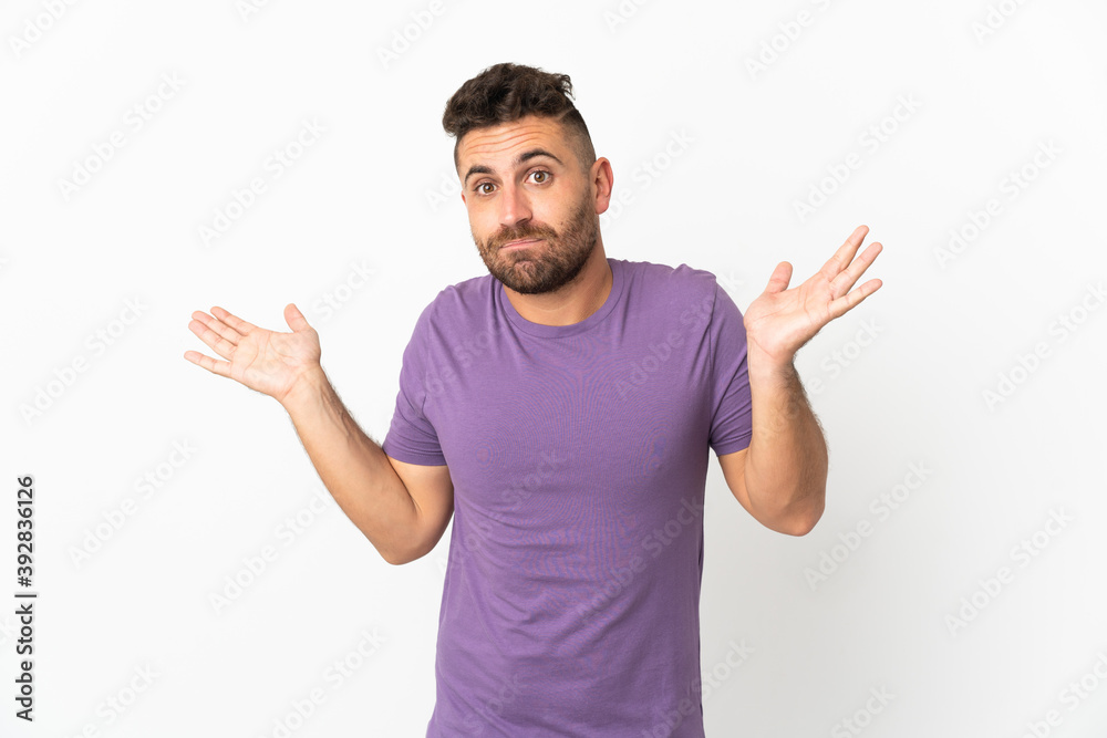 Caucasian man isolated on white background having doubts while raising hands Caucasian man isolated on white background having doubts while raising hands