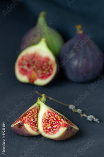 Ripe figs on a black background.