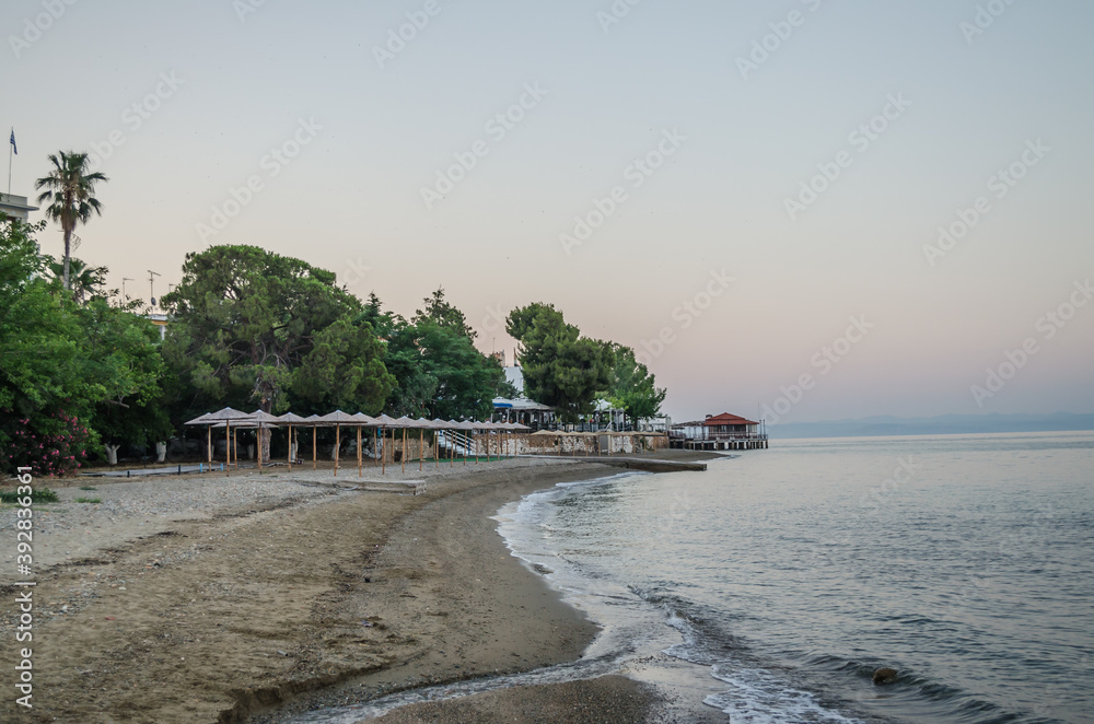 Fototapeta premium Evia island, Greece - June 28. 2020: Sandy beach in the morning on the island of Evia, Greece