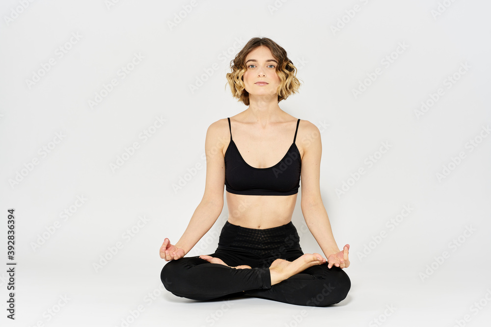woman in dark clothes sitting on the floor and meditation exercises for legs leggings woman in dark clothes sitting on the floor and meditation exercises for legs leggings