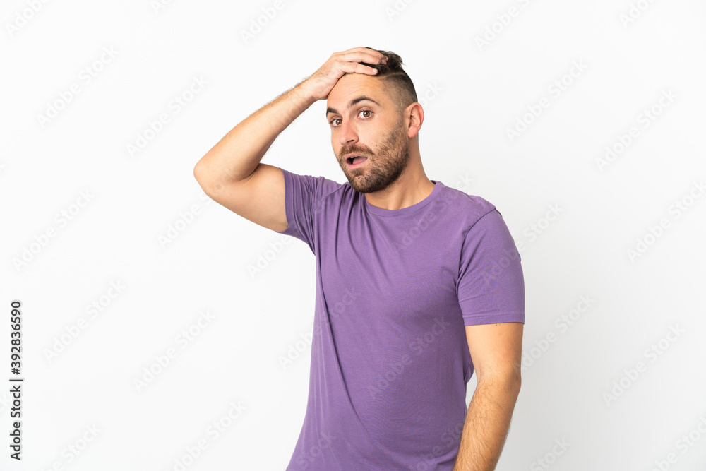 Caucasian man isolated on white background doing surprise gesture while looking to the side