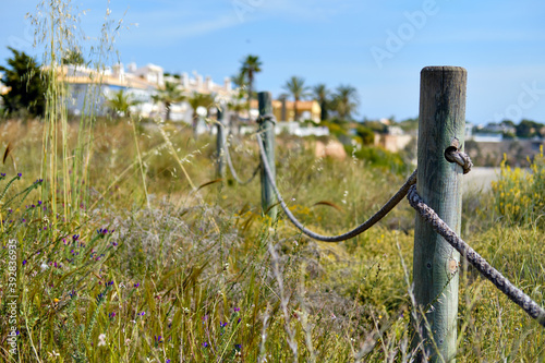 Wooden fencing with rope along the pathway
