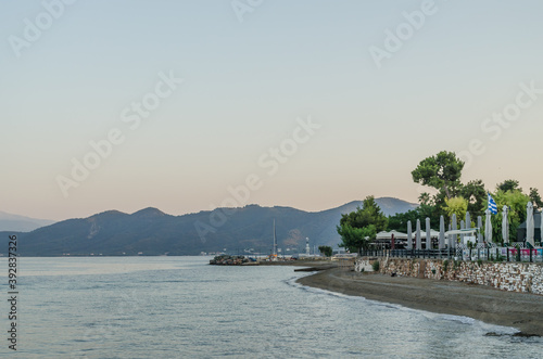 Evia island, Greece - June 28. 2020: Sandy beach in the morning on the island of Evia, Greece  photo