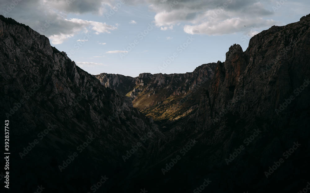 Panoramic view of mountains with sun light coming through