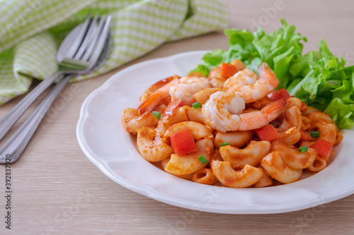 Stir fried macaroni with shrimp and vegetable on plate