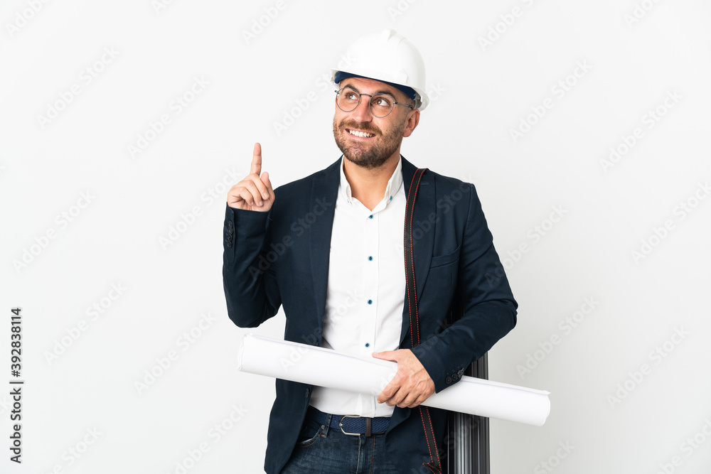 Architect man with helmet and holding blueprints isolated on white background pointing up a great idea Architect man with helmet and holding blueprints isolated on white background pointing up a great idea