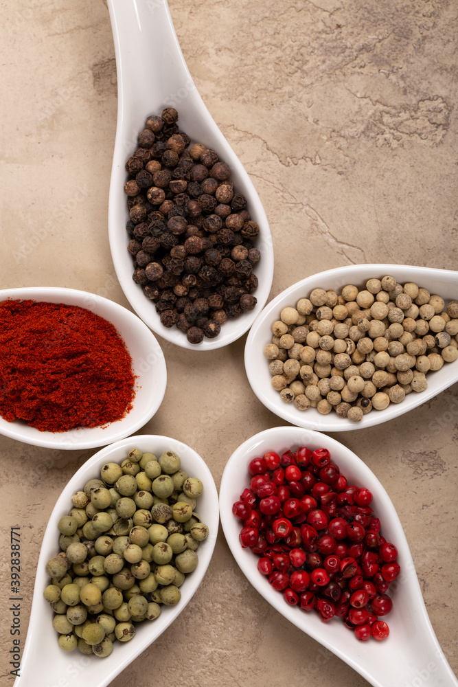 Four Seasons Pepper on beautiful textured background Four Seasons Pepper on beautiful textured background