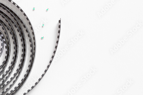 Electronic component on a white background with copy-space. SMD components in tape. Three smd capacitors lie separately