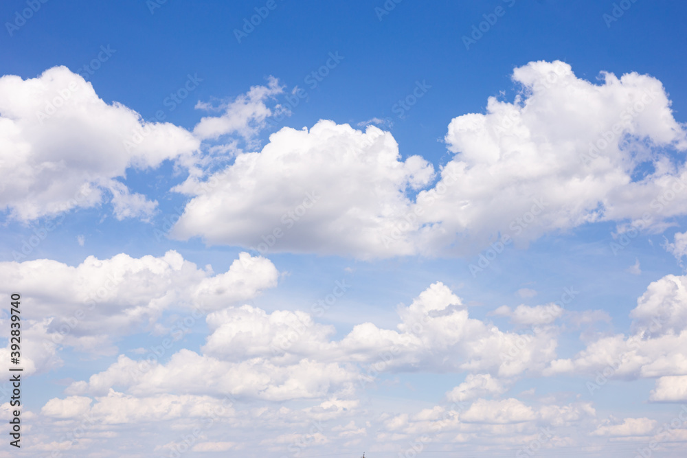 cumulus clouds against blue sky