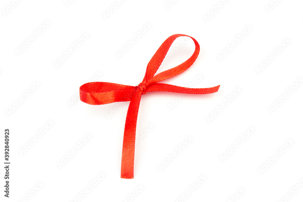 Top view of Red bow isolated shiny rolled on white background. Flat lay view. Top view of Red bow isolated shiny rolled on white background. Flat lay view.
