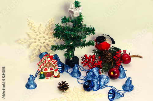 Christmas tree with gifts, Christmas house, bullfinch bird and Christmas decorations on white background