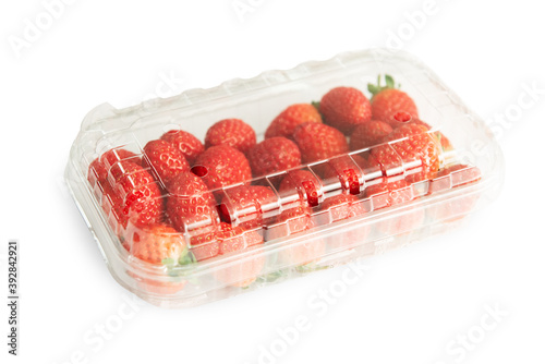 Strawberries in plastic bag isolated on a white background