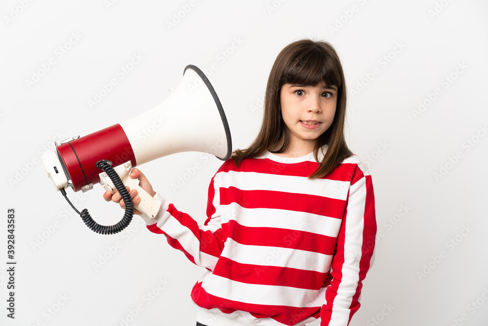 Little girl isolated on white background holding a megaphone with stressed expression Little girl isolated on white background holding a megaphone with stressed expression