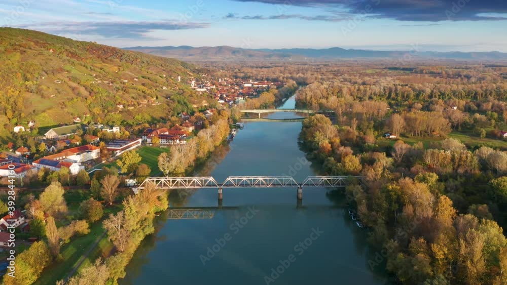 Tokaj, Hungary - 4K flying above River Tisza at the town of Tokaj on a warm, sunny autumn morning with blue sky and golden vineyards Tokaj, Hungary - 4K flying above River Tisza at the town of Tokaj on a warm, sunny autumn morning with blue sky and golden vineyards