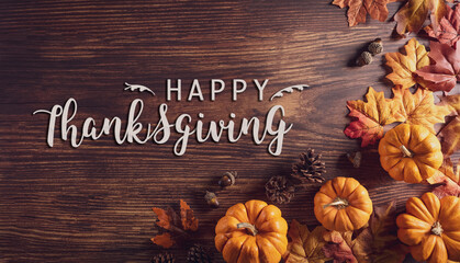 Thanksgiving background decoration from dry leaves and pumpkin on old wooden background. Flat lay, top view for Autumn, fall, Thanksgiving concept.