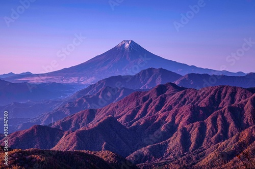 The view of Mount Fuji and the mountain range in the autumn during sunrise. As seen from Mt. Gangaharasuri , Mount Gangaharasuri in the Okuchichibu Mountains, Japan