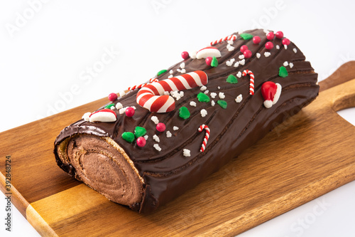 Cuadro en lienzo Chocolate yule log christmas cake isolated on white background
