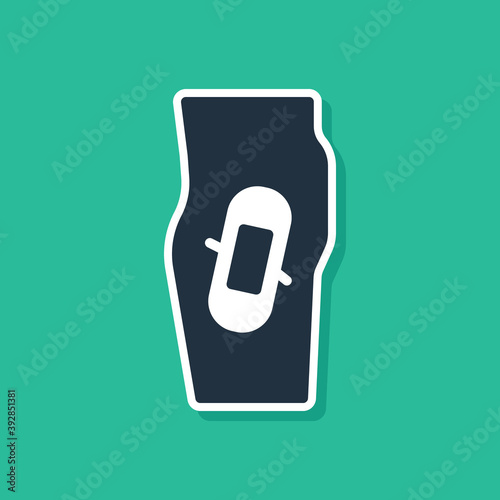 Blue Plaster on leg icon isolated on green background. Vector.