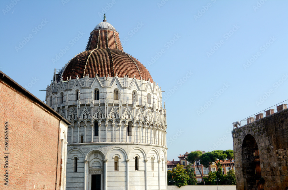 The baptistery of San Giovanni is one of the monuments of the Piazza dei Miracoli, in Pisa. In front of the leaning tower of Pisa and the Cathedral.  