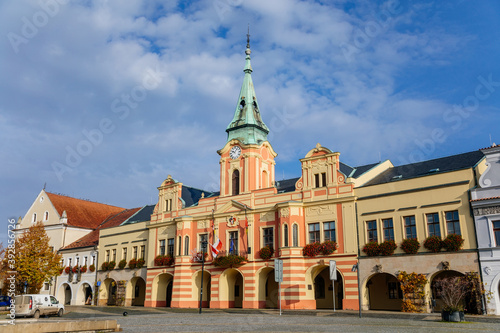 Baroque town hall with clock tower at main Peace square of historic medieval royal town Melnik, colorful renaissance houses in sunny autumn day, Central Bohemia, Czech republic