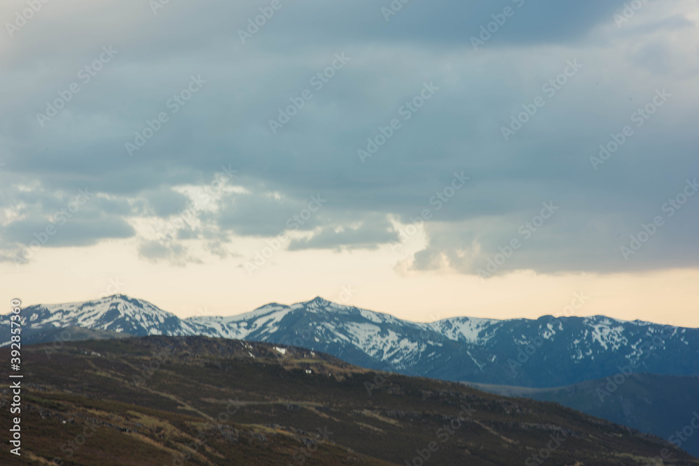 clouds over the snowy  mountains