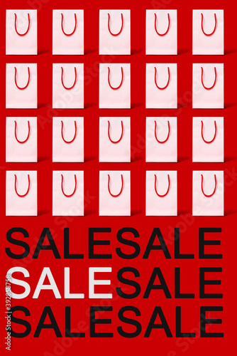 text sale and white shopping bags