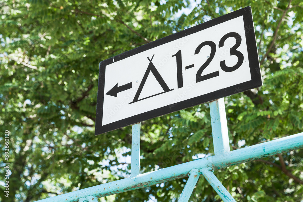 Camping road sign with a number of place