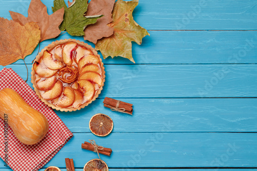 Apple tart pie on blue wooden background