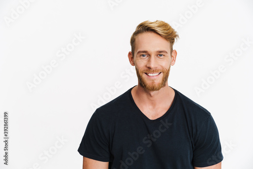 Tela Cheerful caucasian blonde man posing and smiling at camera