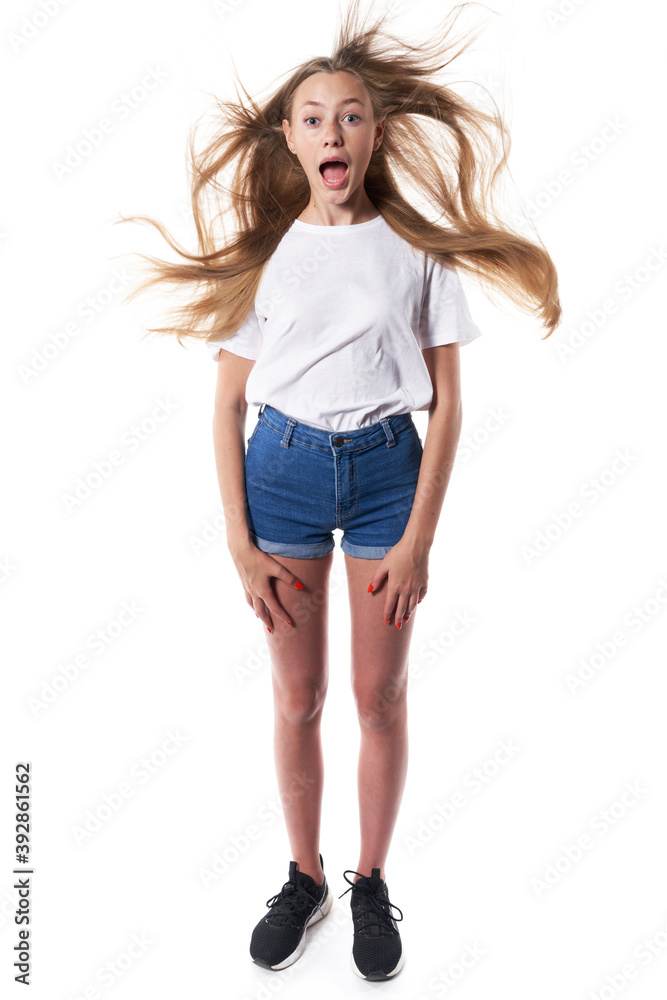 Shocked teen standing over white background shouting Shocked teen standing over white background shouting